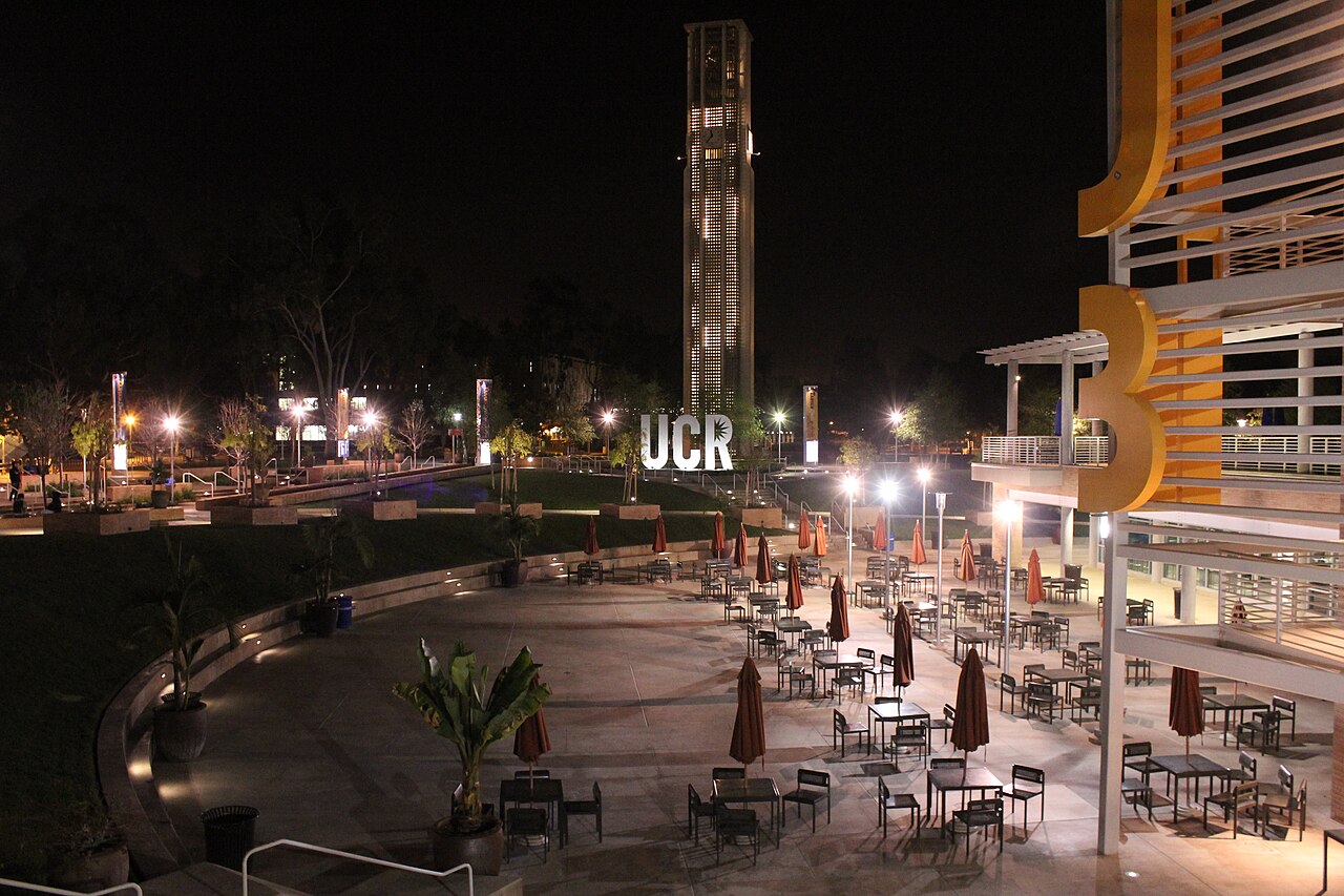 Night shot of the Carillon Bell Tower at UCR from the HUB area